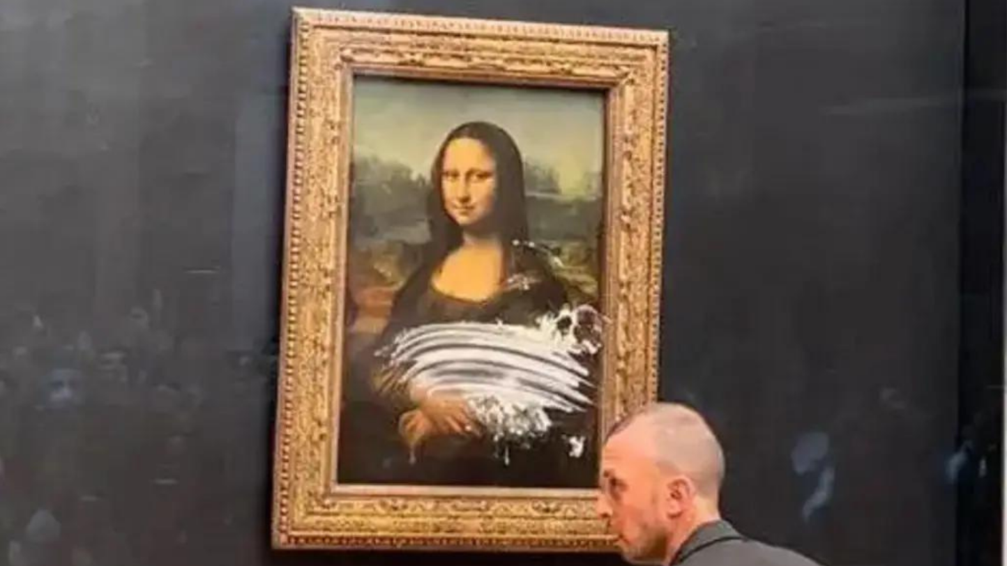 Homem atira tarte à famosa pintura Mona Lisa no Louvre